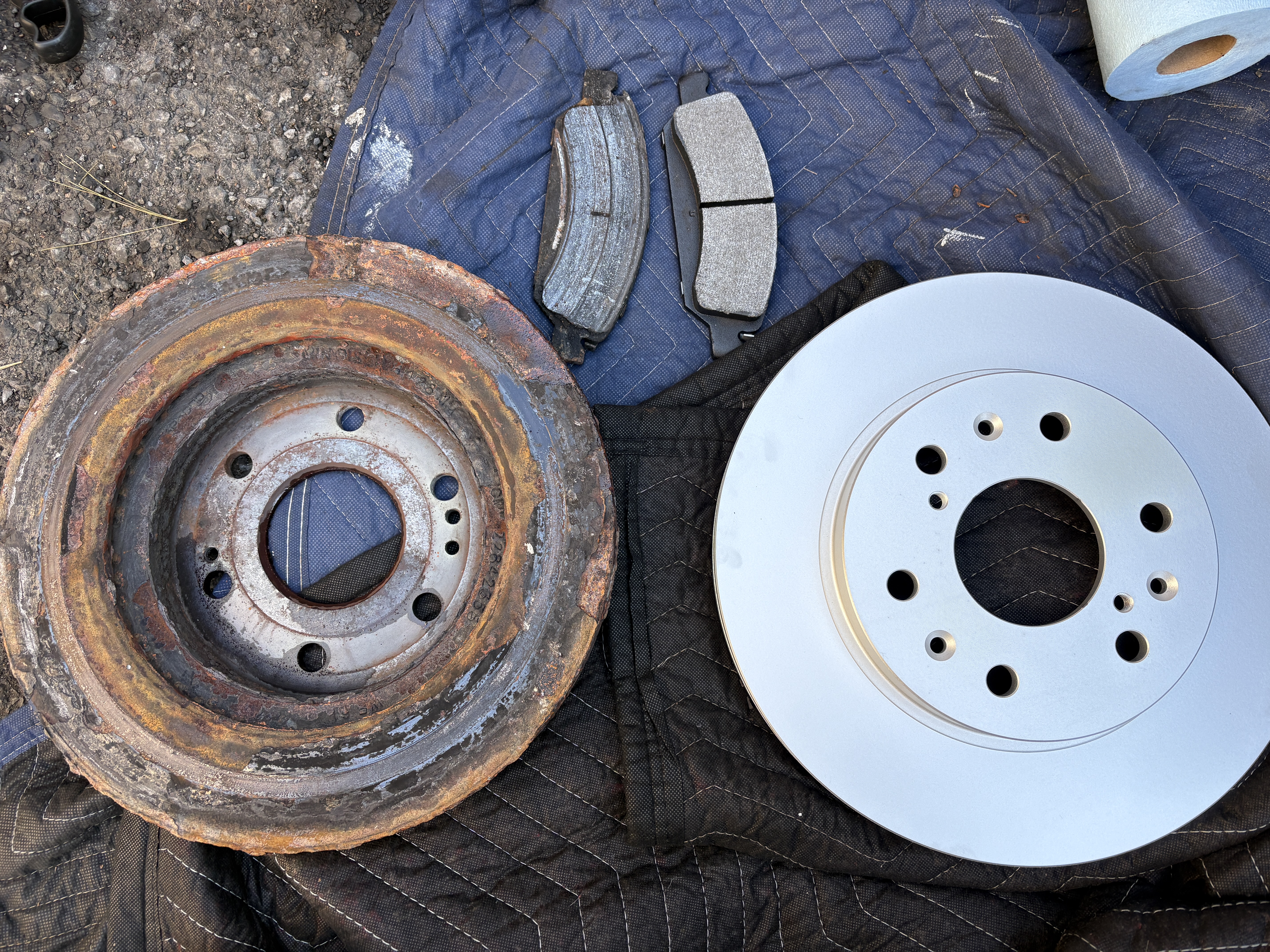 Old and new brake rotors comparison with new pads