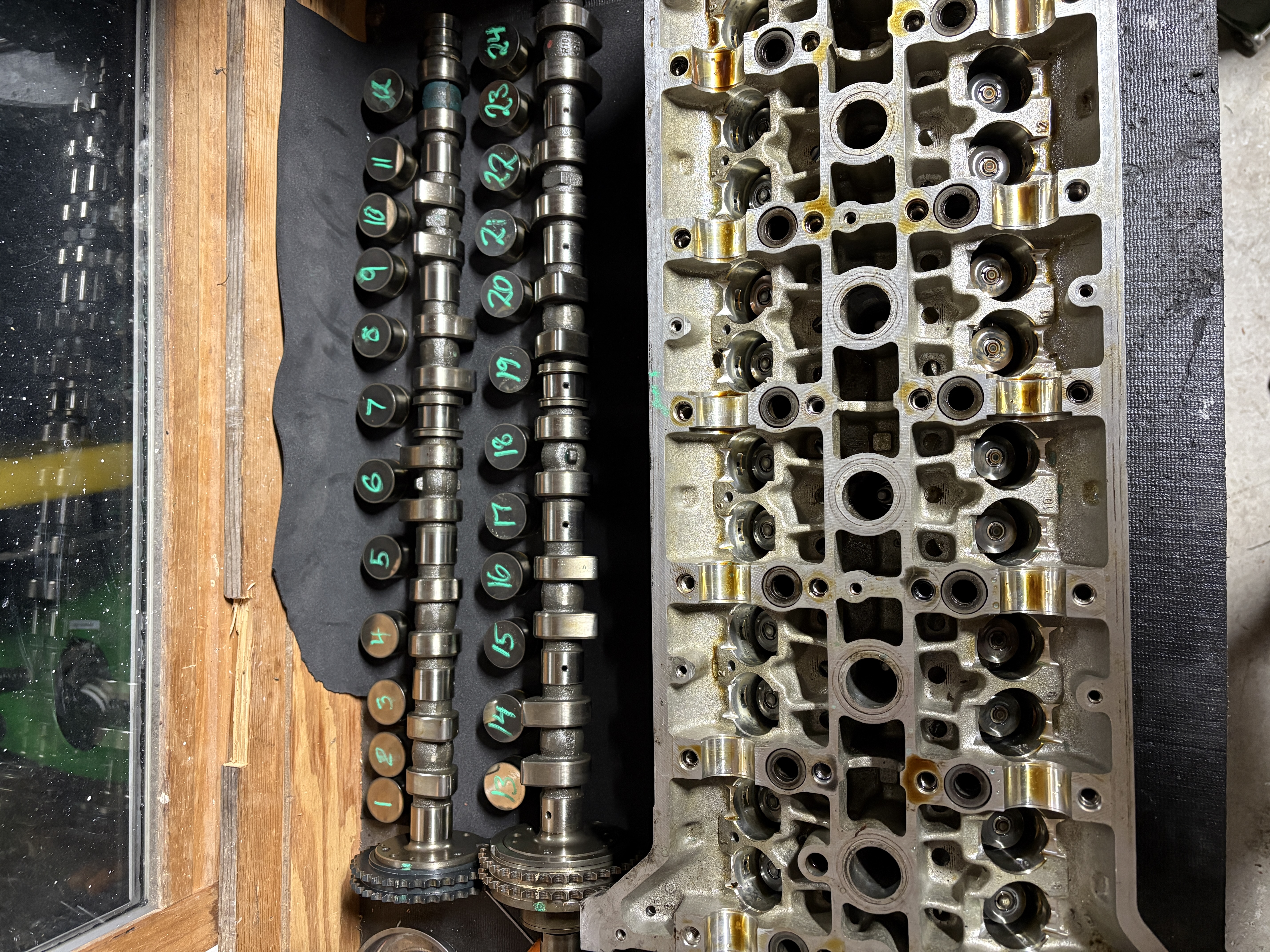 Mercedes M104 camshafts and valve train components laid out