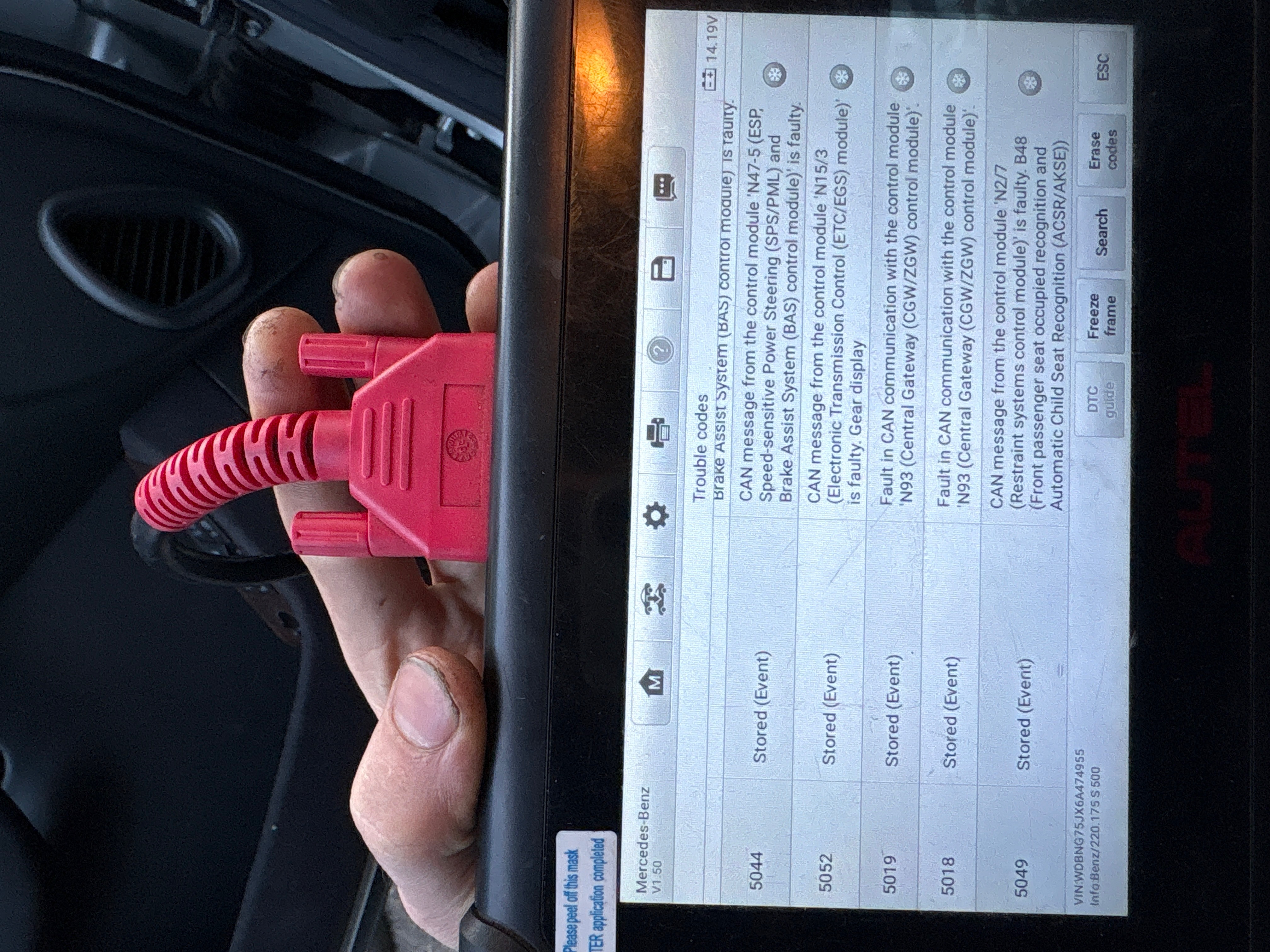 Autel diagnostic scanner connected to Mercedes showing fault codes